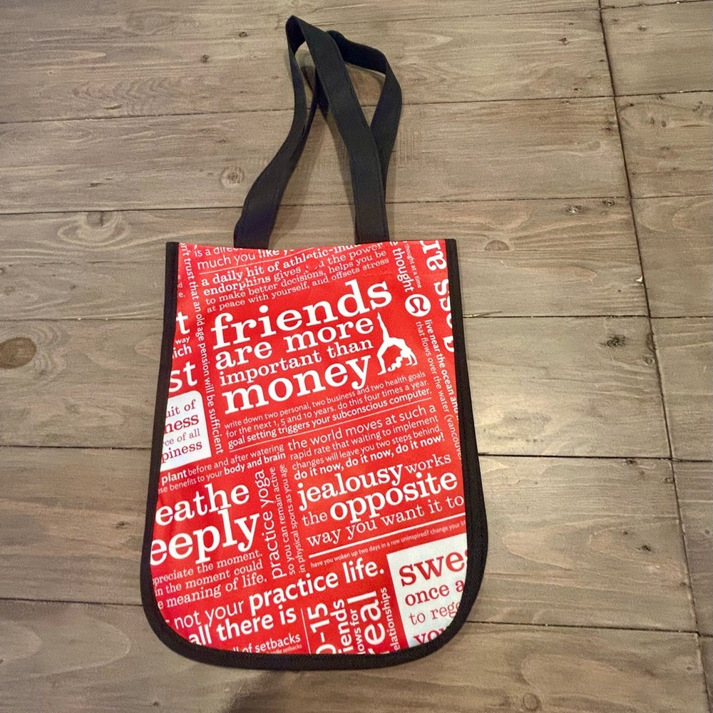 Lululemon tote with clasp, red, black and white, 9”x 12”